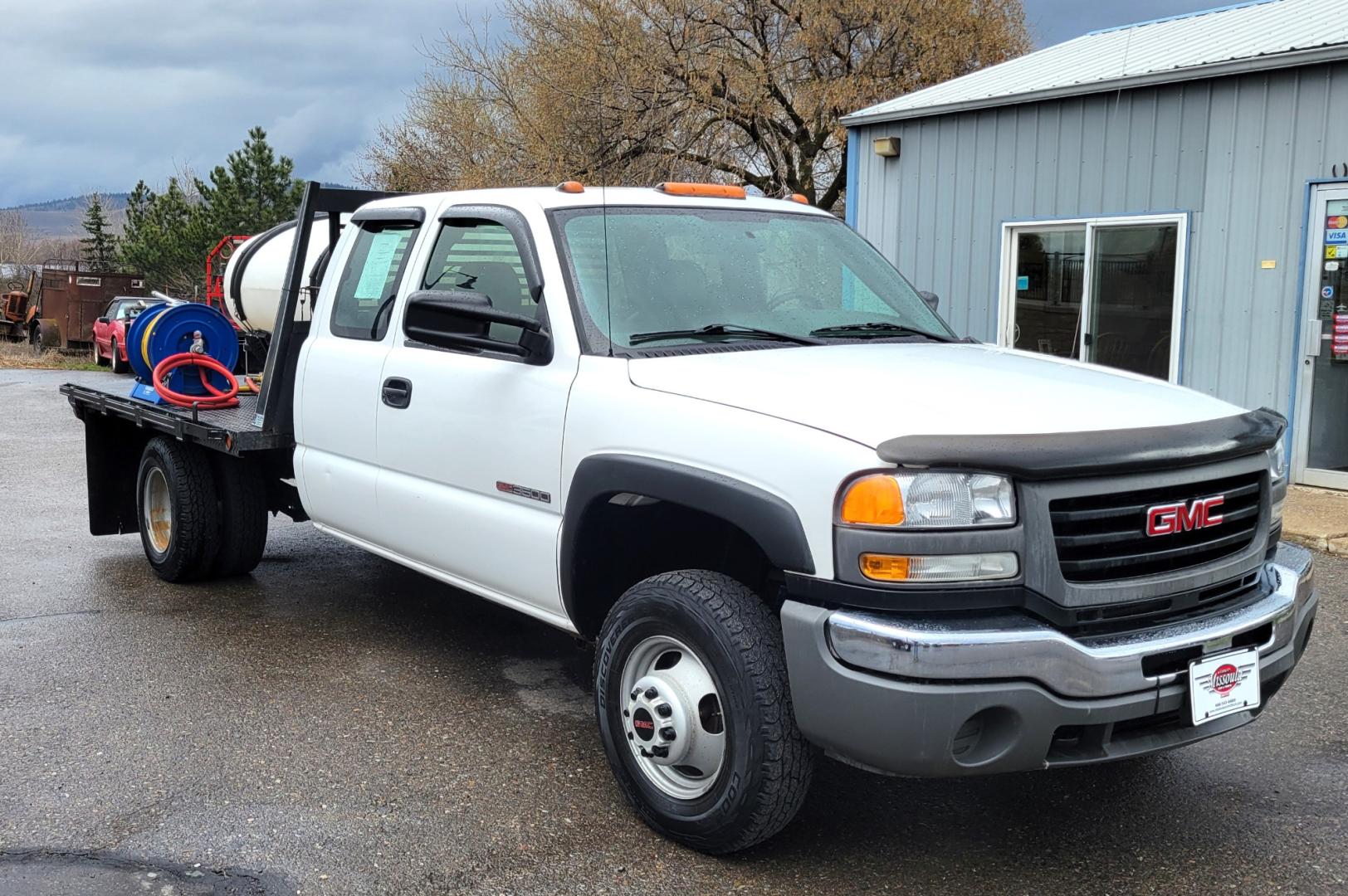 2005 White /Black GMC Sierra 3500 Ext. Cab 4WD (1GDJK39G65E) with an 8.1L V8 OHV 16V engine, Automatic transmission, located at 450 N Russell, Missoula, MT, 59801, (406) 543-6600, 46.874496, -114.017433 - One Owner Beast of a Truck. 8.1l v8 Engine. 4 Wheel Drive. Automatic Transmission. Dual Rear Tires. Air Conditioning. AM FM. Water Tank. 8hp Honda {Pump with two Hose Reels and Sprayers. - Photo#1